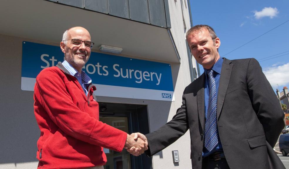 Photograph by Tony Charnock: David Pollock of Haldons Ltd. (right) hands over new St. Neots Surgery, Plymouth to Dr Ben Tutty