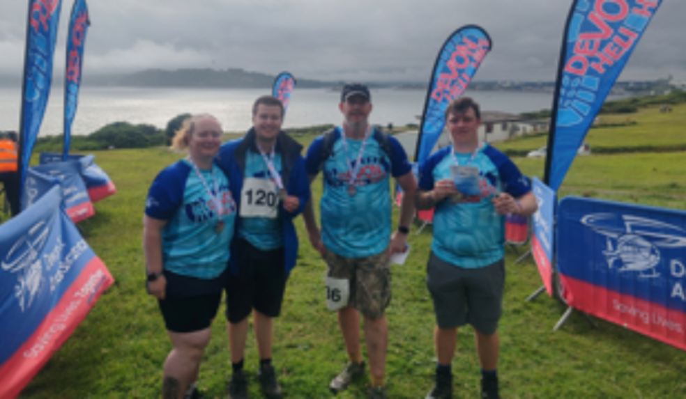 Local Bus Drivers Take on Gruelling Heli Hike to Support Devon Air Ambulance 4 stage coach workers with their medals
