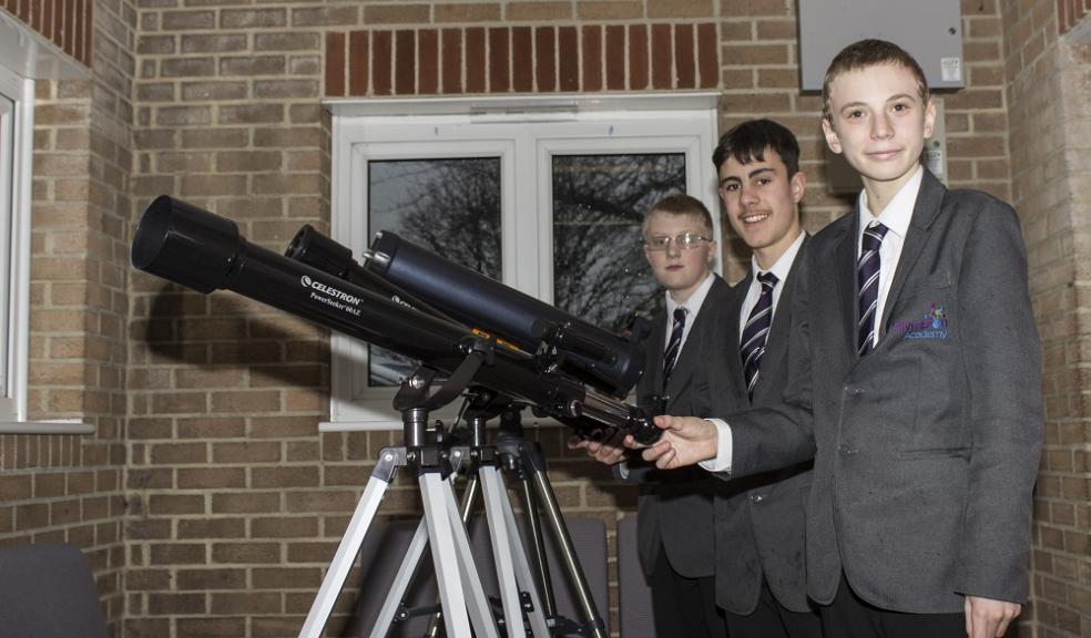 Photo caption: From left to right, Stephen, Lewis and Ben with their telescope.