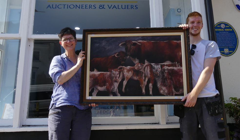 People holding a painting