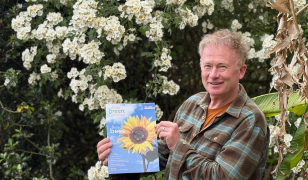 Toby Buckland holding an eco magazine