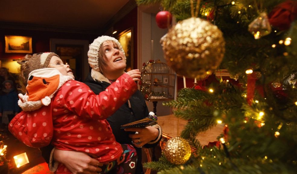 Visitors admiring the Christmas decorations at Saltram, Devon. Photo: National Trust Images, John Millar.