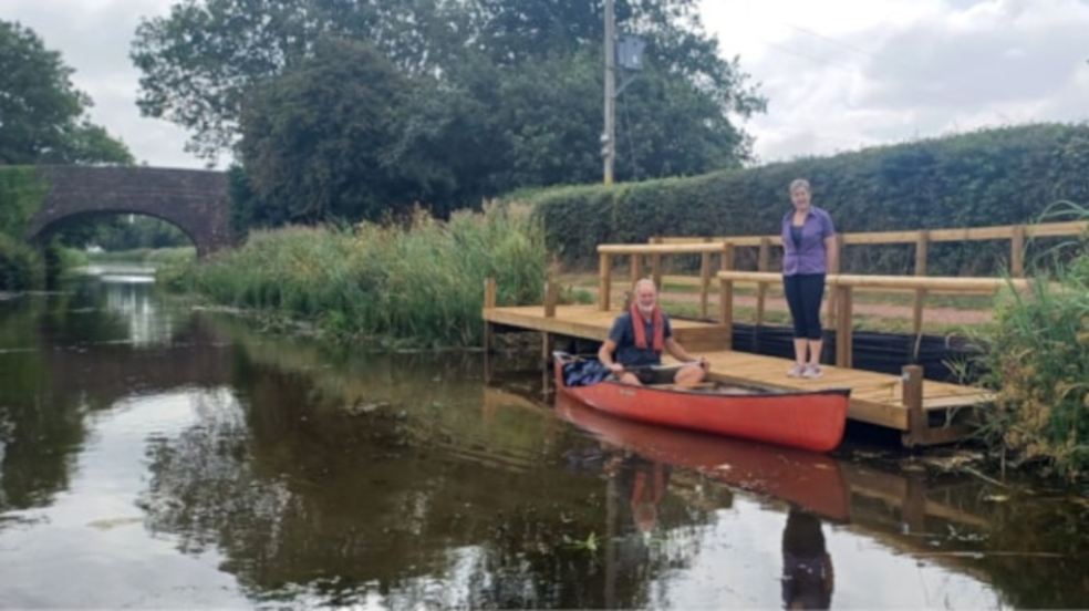 New landing stage for watersports at Grand Western Canal Man in a kayak on the river