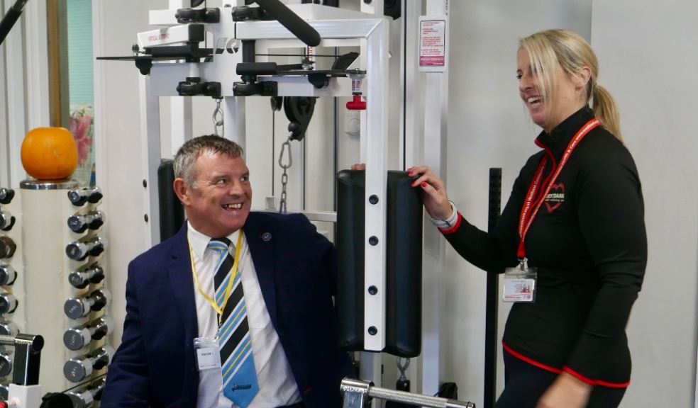 Westbank - ECF trustee David Bird tries out the Equalizer under the instruction of Westbank Gym Manager Natasha Willis. Photo: Sharon Goble.