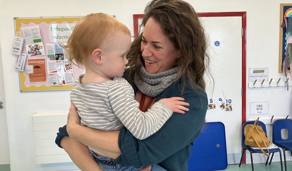 Westbank's Kidzone Manager Lucy Elliott with one of the toddlers in her care 