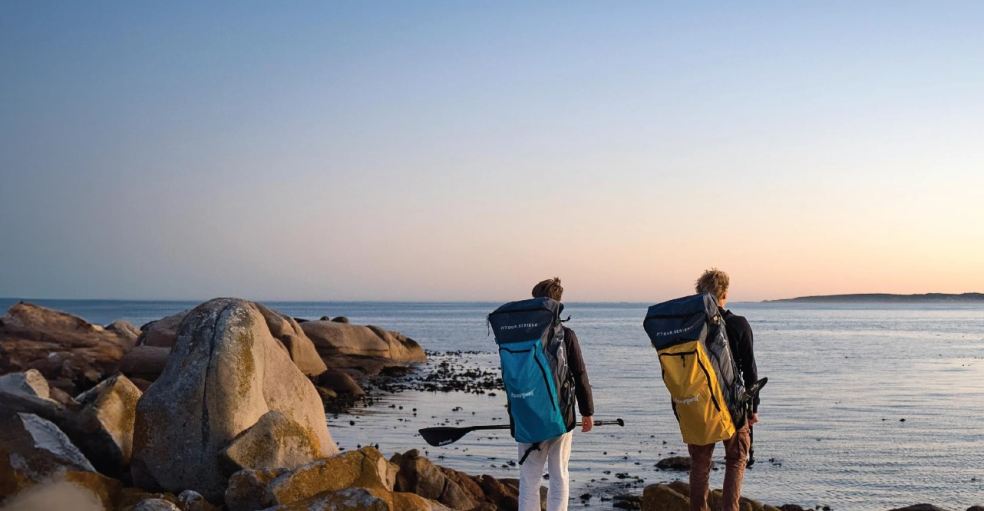 Paddlers by the sea