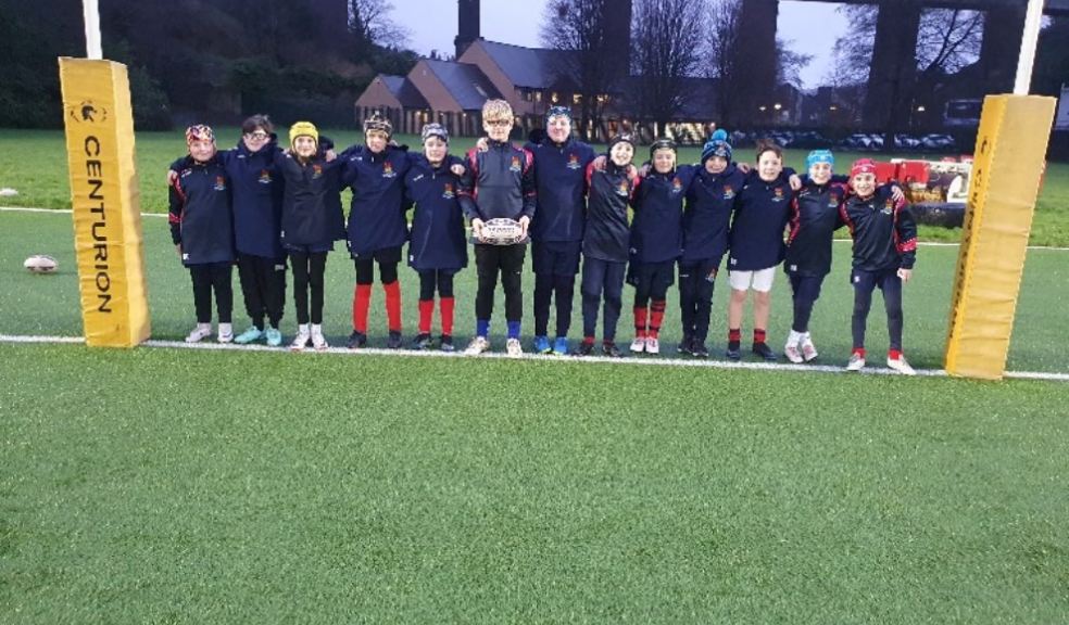 Devonport Services Under 11s rugby team proudly wearing their new jackets