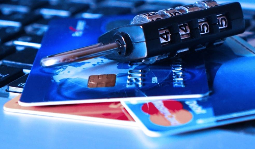 Computer, credit/debit cards and a padlock
