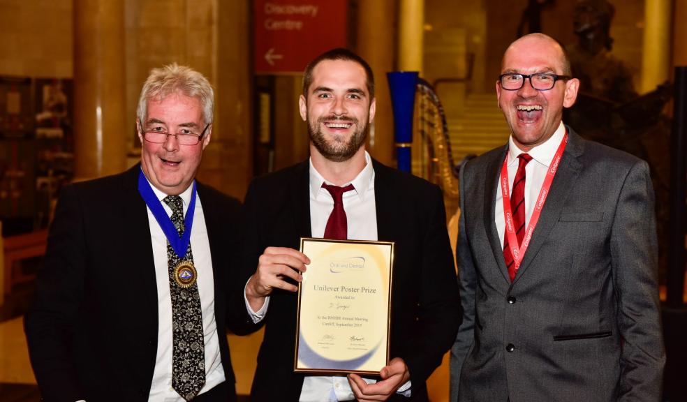 David Singer from Plymouth University Peninsula Schools of Medicine and Dentistry receives the national BSODR Unilever poster prize, presented by Professor Mike Lewis, President of the BSODR (left) and Dr. Simon Whawell, Chairman of the BSODR Prizes Committee.