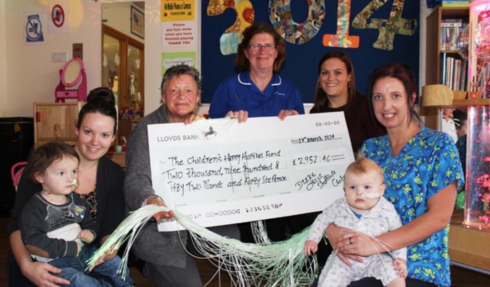 Mum Sonia Daly with son Oscar, Chris Franks from the Children’s Happy Hospital Fund, Ward Manager Sally Hancock, Rachel Stephens from Drake Circus and Play Specialist Sam Cartwright with baby Oscar Tobin
