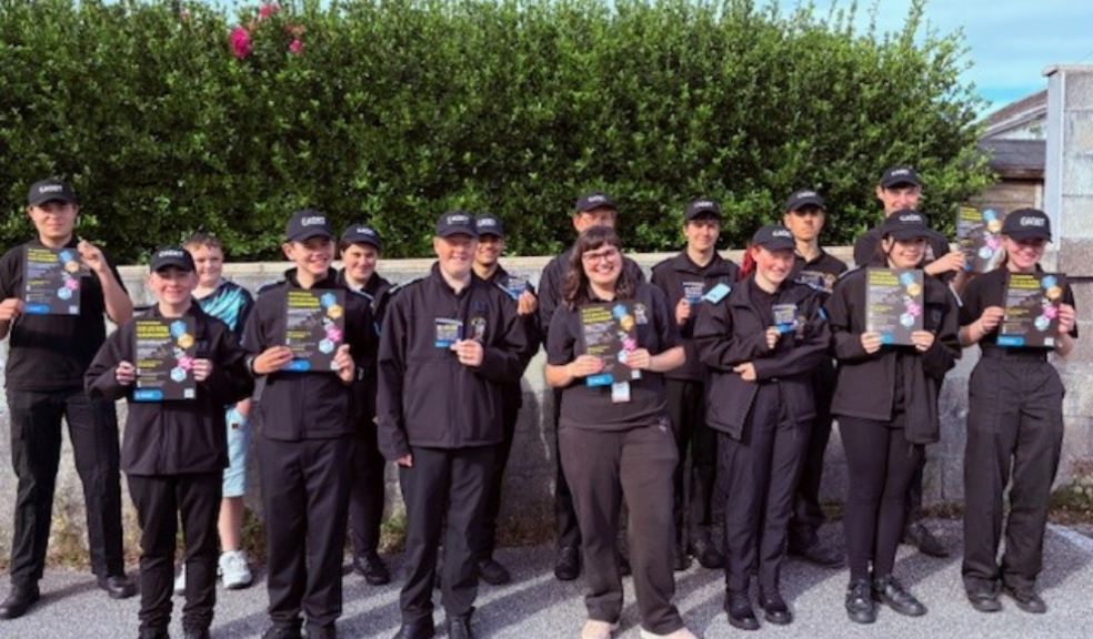 Photo caption: Police Cadets out and about to meet residents in Camborne with posters and window stickers.