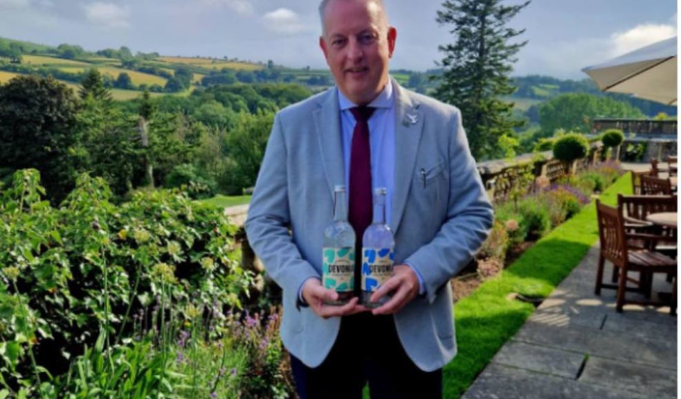 Photo caption: Dean Gunston, General Manager of Bovey Castle Hotel, with bottles of Devonia Water
