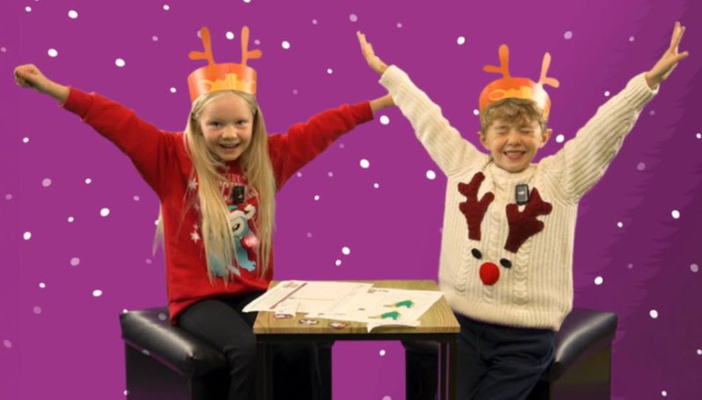 Photo caption: A still image capturing the children creating educational films with Tubers.