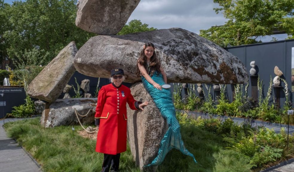 Photo caption: 10-year old Athena, a ‘Little Mermaid’ from Whitstable poses on a the 16-tonne, 3-boulder ‘Trident,’ an inconceivable stonebalance by sculptor Adrian Gray (from Axminster) being shown at RHS Chelsea Flower Show.