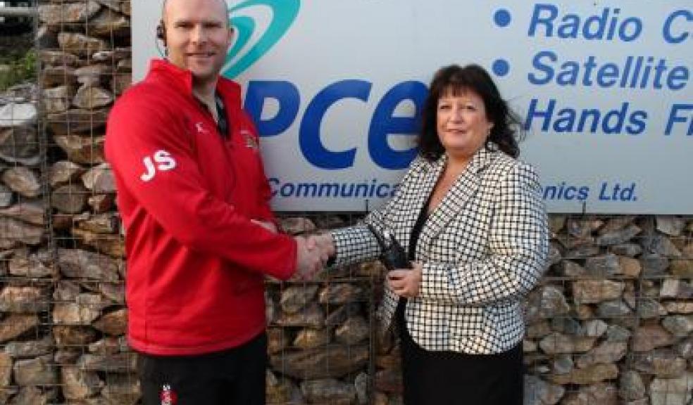 PCE CEO Karen Langley hands over the new secure digital radio solution to Plymouth Albion head coach James Shanahan