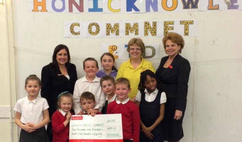 Elaine Bleazard (Branch Director Santander), Denise Taylor (Play Care Manager) Dawn Young (Branch Manager Santander) and children from the Honicknowle Play Group.