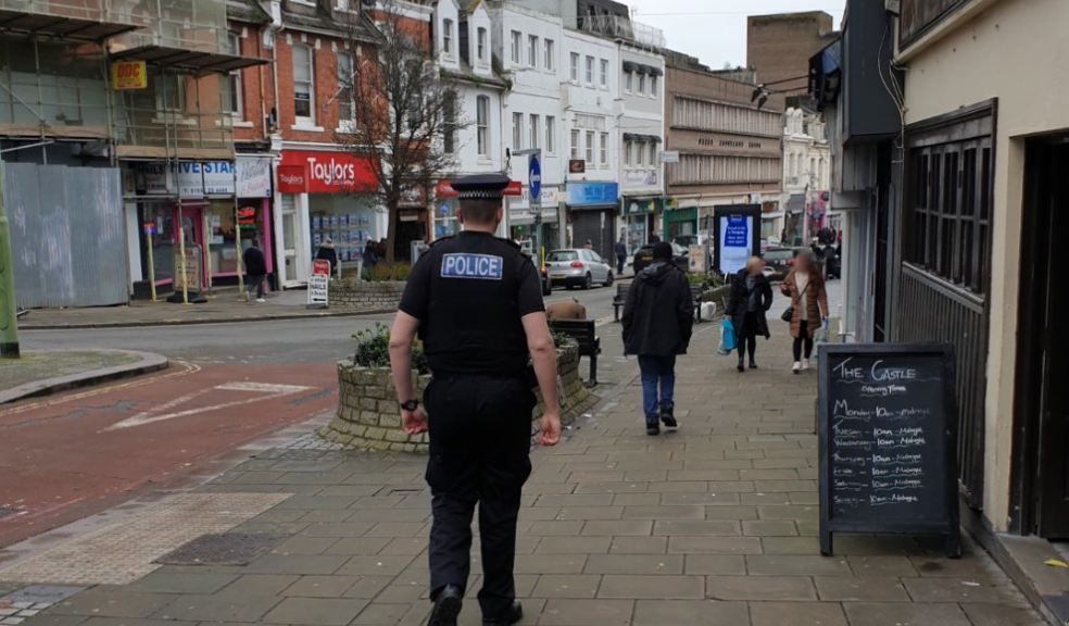 Photo: Uniformed police officer on foot patrol in Torquay
