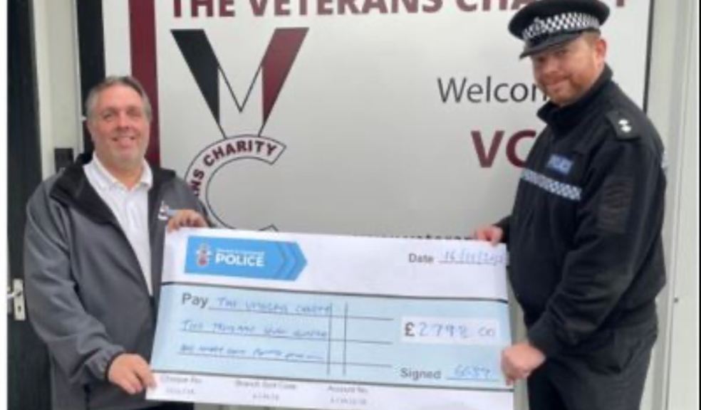 Picture shows Barnstaple Sector Inspector Andy Wills presenting a cheque to Danny Greeno, Chief Executive of The Veterans Charity