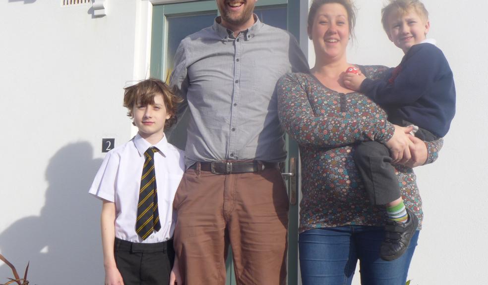 Photograph by Glen King : Sebastian (8) and OSCAR (4) with Warren Wilkins (41) and wife Gemma (32) pregnant with their third child outside their C G Fry & Son Home in Tregunnel Hill, Newquay