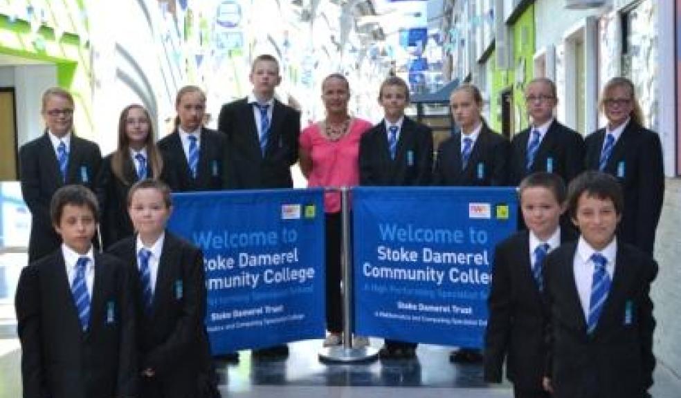 From centre: Kay Lewis flanked by (l to r): Joseph and Charlie Knight Charlotte and Chloe Zisimides Chloe and Aimee Bond Charlotte and Abigail Milden Kneeling: Andrew and Steven Turner Kneeling at the front: Cody and Ethan Evans