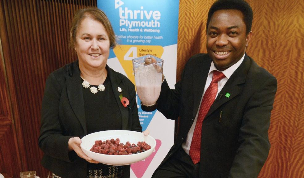 Dr Kelechi Nnoaham, Director of Public Health, and Councillor Sue McDonald try the Smoothie bike at our Thrive launch