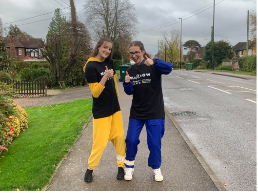 Two members of the Warwick Marrrow committee completing a three-legged 5km.