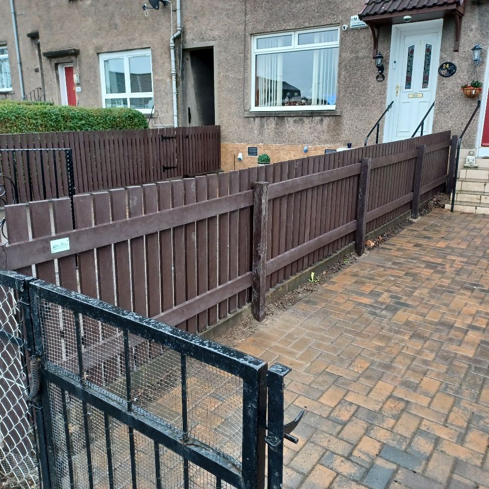 Brown fencing between two houses 