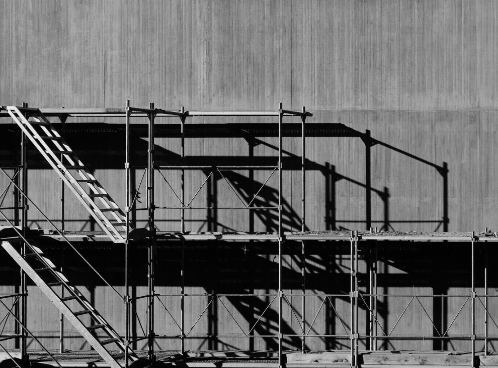 Scaffolding on a residential building under construction on a grey day
