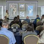Presenter giving a talk to delegates at Sandy Park in Exeter