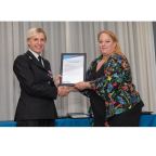 Photo: Joanne Raw receiving her award from Ch/Supt Alexandra Doughty.