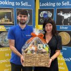 Barnaby Willis and Amelia Draper with Chilcotts prize hamper which can be won at the Honiton Show