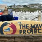 The wave project on a surf board