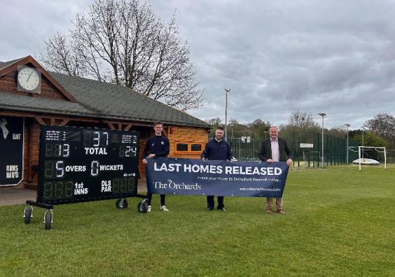 Heathcoat Cricket Club vice-chairman Chris Salter, Edenstone sales consultant Darren Kellaway, and Heathcoat Cricket Club chairman Dean Edwards, by the side of the new digital scoreboard and pavilion