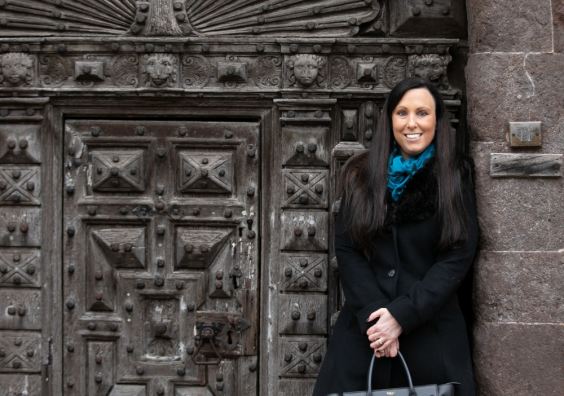 Rachel Buckley from The Family Law Company Family lawyer standing in front of gate