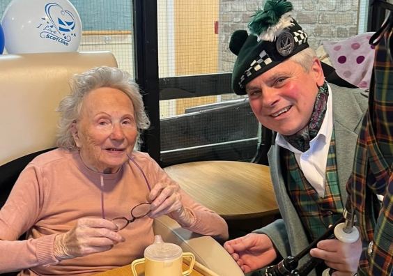 Butterfly Lodge resident Audrey with Dave The Lone Piper Butterfly Lodge resident Audrey with Dave The Lone Piper