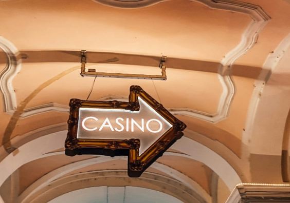 A casino sign hanging from the ceiling.