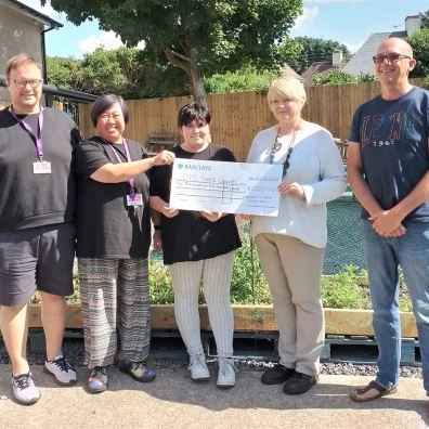Space Youth Services receiving a cheque for garden enhancements in Barnstaple