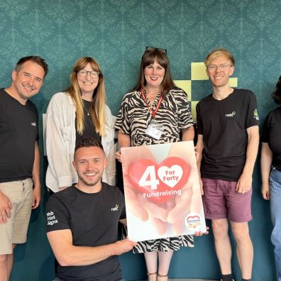 Westbank's Katie Elliott, centre, with the supportive team at Nettl