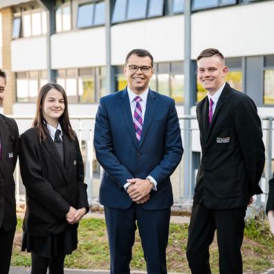 Headteacher Lee Sargeant with students from All Saints Academy