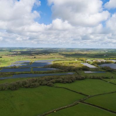 Aerial view of a large solar installation on Devon farmland (image by Devon CPRE)