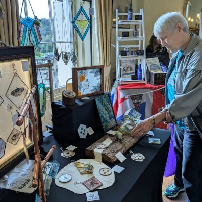 Browsing the artisan craft fair at Escot