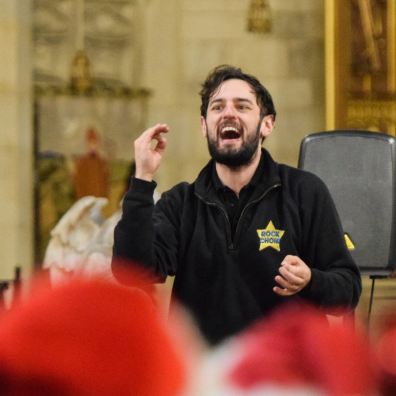 Choir Leader Carey Camel with Rock Choir East Devon