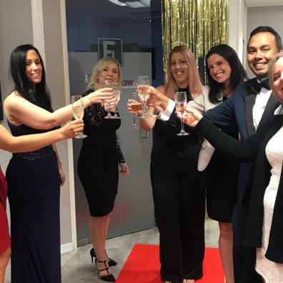Group of lawyers toasting with a glass of fizz