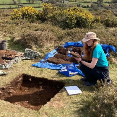 woman digging in dartmoor archaeological dig