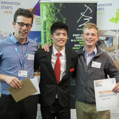 Francesco D’Alessio (left) and Theodore Moule (right) receiving their Tectona Business Challenge award from Santander’s Yingbin Wu.