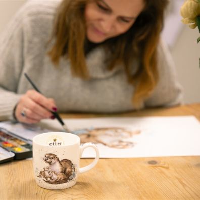 Designer working on artwork for celebratory mug