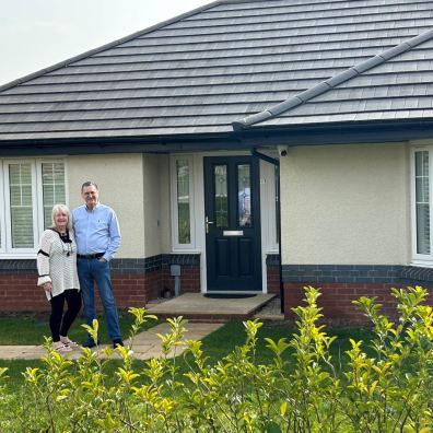 Jenny and Howard Lewis outside their Edenstone bungalow