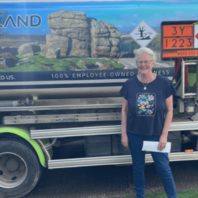 woman stood in front of Moorland Fuels Tanker