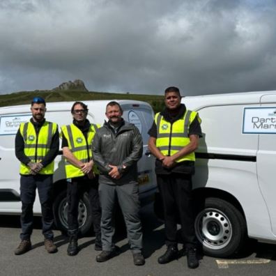 Dartmoor marshals stood in front of vans in Dartmoor