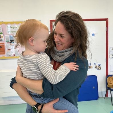 Westbank's Kidzone Manager Lucy Elliott with one of the toddlers in her care 